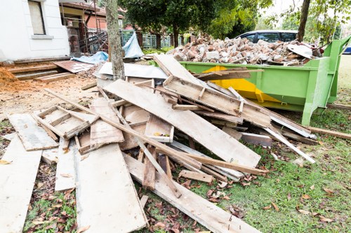 Cluttered garage before clearance in Carshalton
