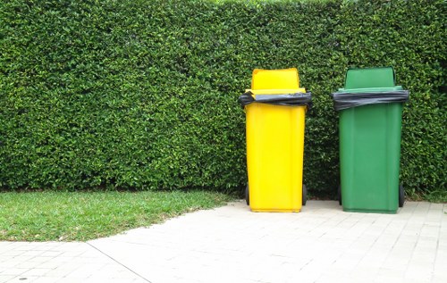 Construction workers managing site waste